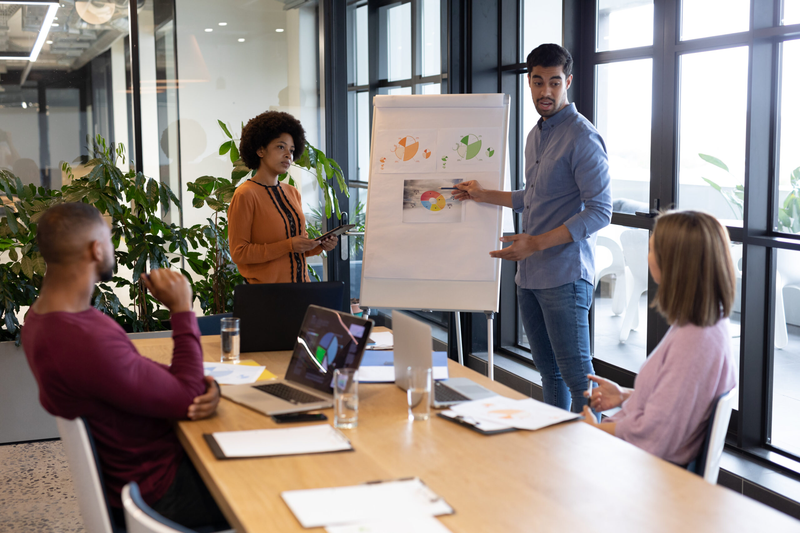 Diverse group of business people working in creative office. group of people in a meeting discussing work. business people and work colleagues at a busy creative office.